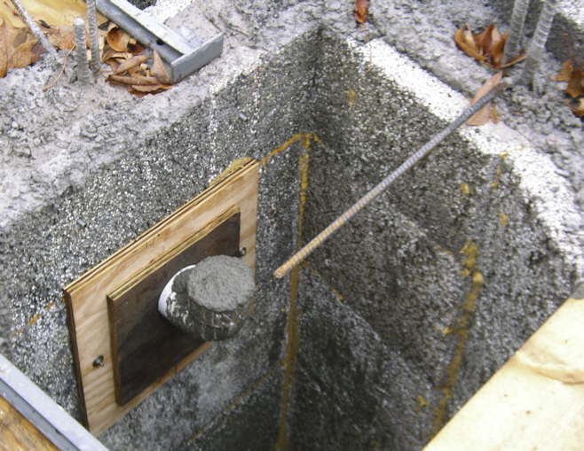 The top of a void fill elbow on the stairwell side of the partition wall